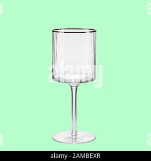Empty wing glass on green background single with clipping path Stock Photo
