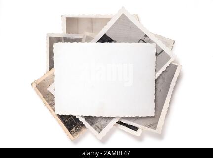 Stack of old photos isolated on white background Stock Photo