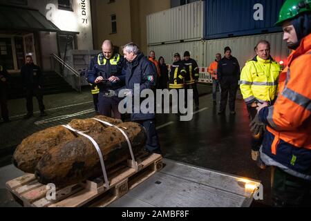 Dortmund, Germany. 12th Jan, 2020. Bomb squad members photograph the detonator of one of two defused bombs lying on the back of a truck. No unexploded ordnance had been detected at two other suspected sites. The aircraft bombs were located in a densely populated residential area. As a result, some 14 000 people had to leave their homes. Credit: Bernd Thissen/dpa/Alamy Live News Stock Photo