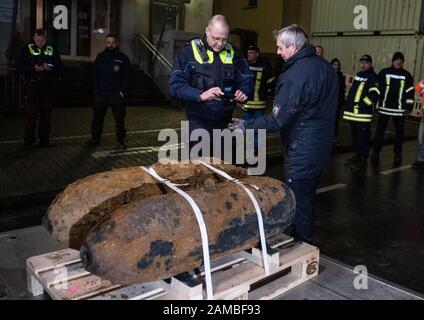 Dortmund, Germany. 12th Jan, 2020. Bomb squad members photograph the detonator of one of two defused bombs lying on the back of a truck. No unexploded ordnance had been detected at two other suspected sites. The aircraft bombs were located in a densely populated residential area. As a result, some 14 000 people had to leave their homes. Credit: Bernd Thissen/dpa/Alamy Live News Stock Photo