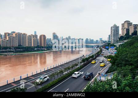 Chongqing, China - July 23, 2019: Multilayer roads and traffic by the Yangtze river in Chongqing, China Stock Photo