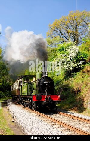 LNER Class J72 0-6-0 No 69023 Joem passing Beck Hole on the North Yorkshire Moors Railway. (photographed from a safe location) Stock Photo