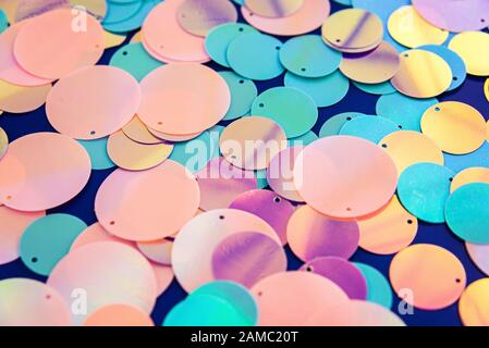 Big round holographic sequins abstract colorful background. Stock Photo