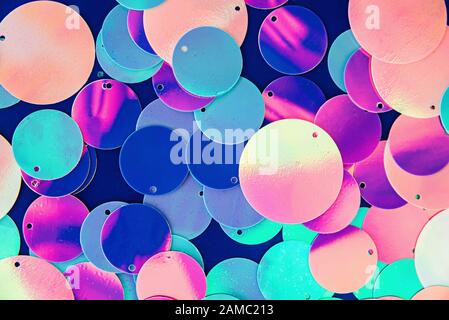 Big round holographic sequins abstract colorful background. Stock Photo