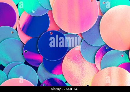 Big round holographic sequins abstract colorful background. Stock Photo