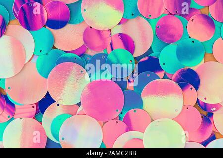 Big round holographic sequins abstract colorful background. Stock Photo