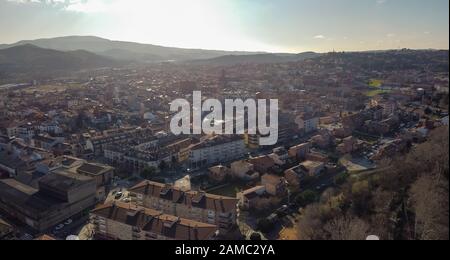Aerial view of Sant Celoni city in Catalonia. Dusk early morning shot against the sun Stock Photo