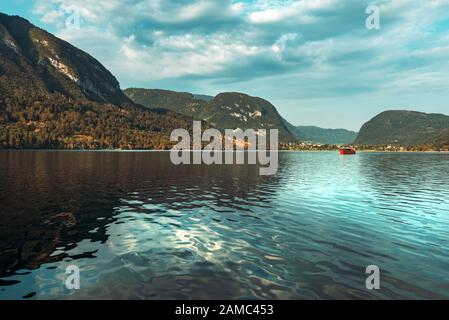 Lake Bohinj and surrounding mountain landscape in summer, famous travel destination in Slovenia national park Triglav Stock Photo