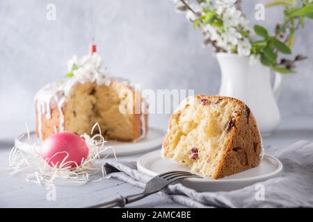 Easter orthodox cake and colorful red egg, spring flowers. Close up. Holidays traditional breakfast. Stock Photo