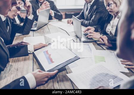 Business people team discussing financial data at corporate meeting Stock Photo