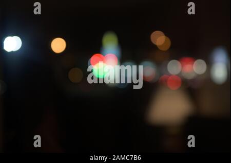 Multi-colored, blurry bokeh balls at night Stock Photo