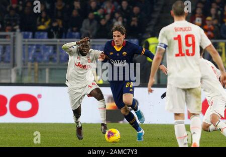 Rome, Italy, 12th January, 2020. Roma s Nicolo Zaniolo, right, is challenged by Juventus Blaise Matuidi during the Serie A soccer match between Roma and Juventus at the Olympic Stadium. Credit Riccardo De Luca - UPDATE IMAGES / Alamy Live News Stock Photo