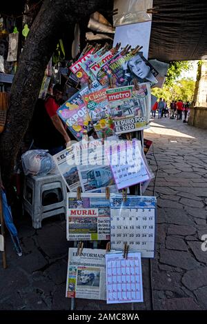 Newspapers and magazines for sale on sidewalk stand in Mexico Stock Photo
