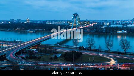 Rush hour & the blue hour combine during this capture of the UFO Bridge at Bratislava. Stock Photo