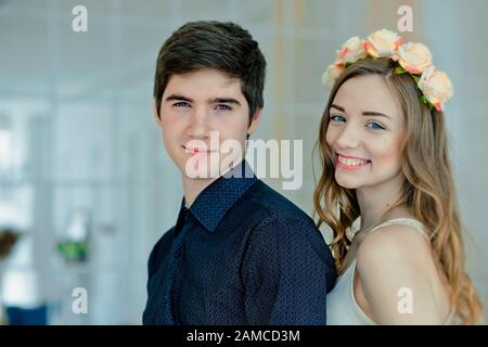 young beautiful woman leaned forehead against t back of head of man. Beautiful loving couple on Valentine's Day. boy thinks what gift to give for Marc Stock Photo