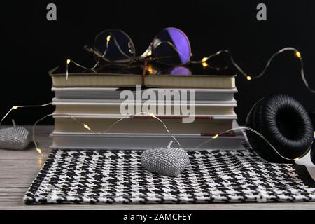 Stack of books and notepads on which are glasses and on the side of headphones. nice background. top views Stock Photo
