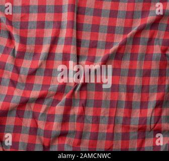 red checkered fabric for sewing various clothes with waves, full frame Stock Photo