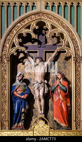Sculpture of Jesus Christ on the cross with the Virgin Mary and Saint John beside Him. Stock Photo