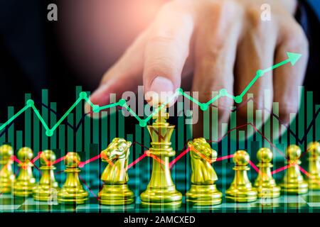 Chess game on chess board on stock market or forex trading graph chart for financial investment concept. Economy trends for digital business marketing Stock Photo