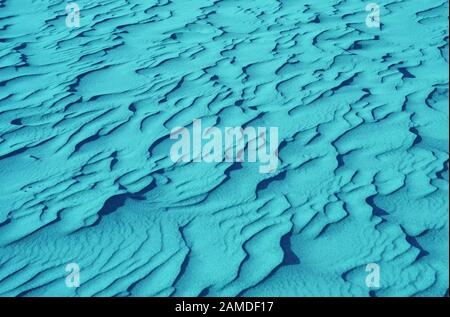 Pop art surreal style turquoise blue colored desert sand ripple patterns Stock Photo