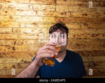 Men drinking beer. Portrait of handsome young men drinking beer. Stock Photo