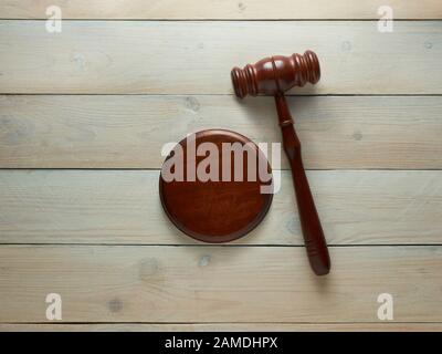 Judge's hammer on a wooden background Stock Photo