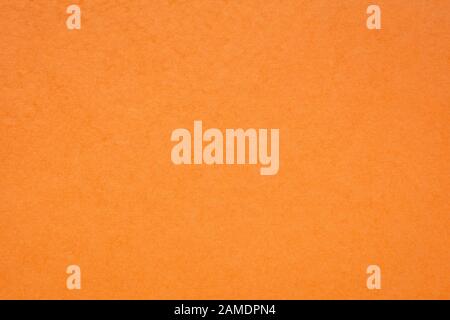 background and texture of orange handmade Indian paper created from recycled cotton fabric Stock Photo