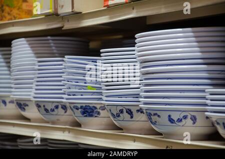 Asian (Chinese and Vietnamese) plastic food bowls displayed, stacked closely on a supermarket shelf for sale in Sydney, Australia Stock Photo