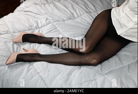 Legs covered from a pair of black pantyhose Stock Photo