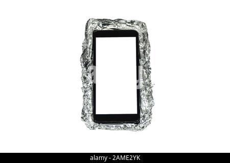 Smartphone and protection case made out of aluminum foil isolated on white background. Stock Photo