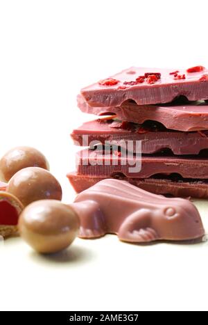 Ruby chocolate selection, made botanical cocoa bean varieties that have the right attributes to be processed into ruby chocolate, from the macro close Stock Photo