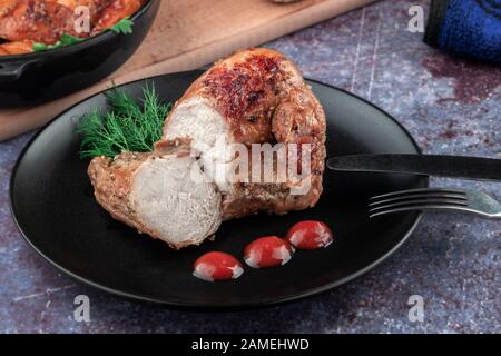 Oven-baked chicken with vegetables and herbs. Home made food. Concept for a tasty and hearty meal. Stock Photo