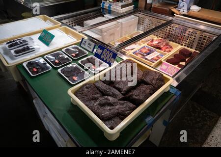 Meat of common minke whale (Balaenoptera acutorostrata) for sale at fish market in Shiogama, Japan, Asia. Shops selling fresh seafood Stock Photo