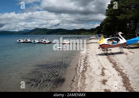 View of Tazawa Lake or Tazawa-ko, Akita prefecture, Japan, Asia, the deepest lake in Japan. Popular Japanese tourist destination with beach and boats Stock Photo