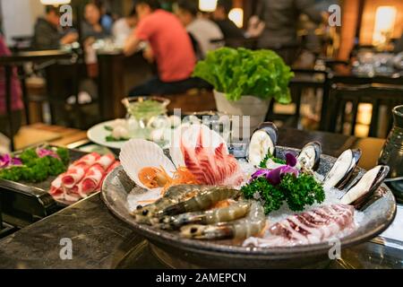 hotpot Chinese sytel with seafood set and belly pork at restaurant Stock Photo