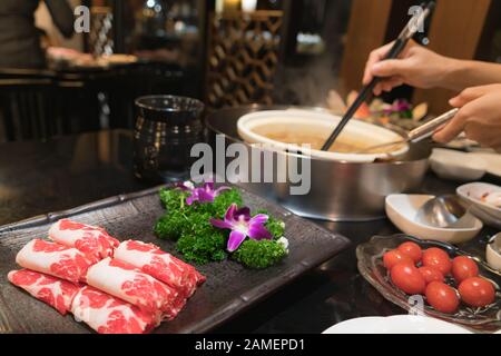 fresh meat set with cherry tomato for Chinese shabu restaurant Stock Photo