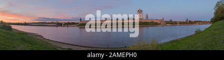 Beautiful panorama of the Kremlin and quay in the city of Pskov at sunset on a summer evening Stock Photo