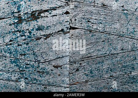Abstract, old, blue marine, wooden door with the painting coming off. Texture background image. Stock Photo