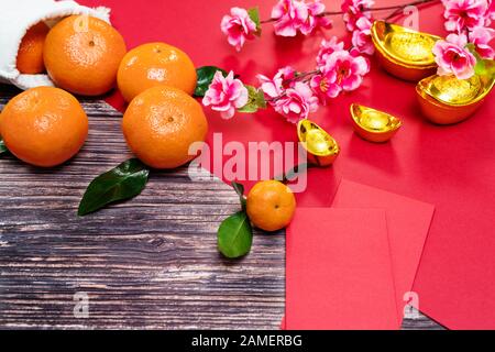 Chinese New Year orange and offering red envelope, Translation of text appear in image: Prosperity, rich and healthy Stock Photo