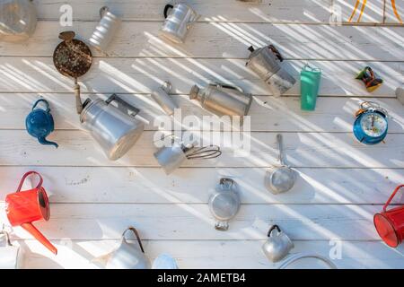 Ancient utensils for preparing coffee or breakfast on a white wooden background Stock Photo