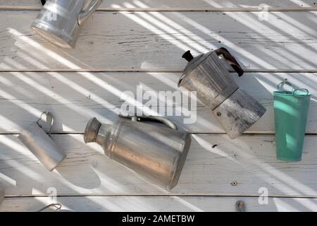 Ancient utensils for preparing coffee or breakfast on a white wooden background Stock Photo