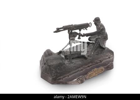 desk set (inkwell) in form of French machinegunner from period WW1. In memory of battle by Mailly. France. 1914-18. Stock Photo