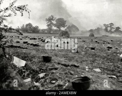 Battle of France: German steel helmets abandoned on the battlefield in Normandy, after the Wehrmacht soldiers were sent to an American prisoner of war Stock Photo