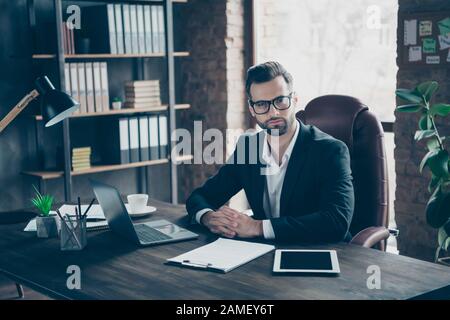 Photo of attentive handsome business guy focused attentively listening vacancy candidate asking interview questions wear specs black blazer shirt suit Stock Photo
