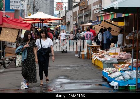 People and tourists visiting Hakodate Asaichi (Morning Market) in Hakodate, Hokkaido, Japan, Asia. Japanese culture and traditional lifestyle Stock Photo