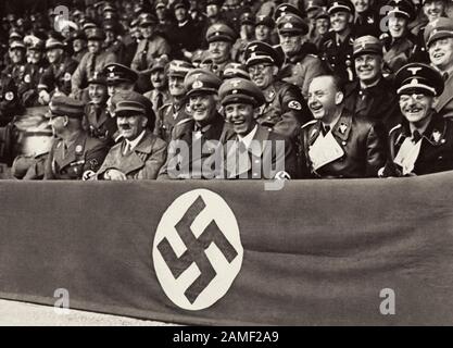 Adolf Hitler surrounded by Joseph Goebbels, Werner von Blomberg, Viktor Lutze, Dr. Dietrich and Fiehler attended a laughing competition at the stadium