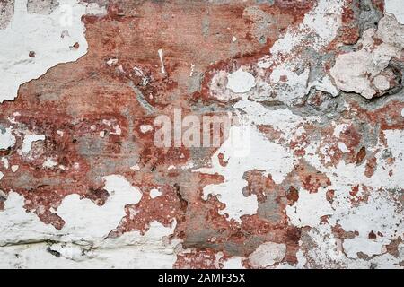 Natural destroyed stone surface. Vintage rustic pattern. Brown background. Old shabby cracked stucco. Dirty wall, grunge texture. Painted concrete, ab Stock Photo