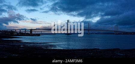 A panoramic image of a stormy sky and the Forth Road Bridge, seen from South Queensferry, Edinburgh, Scotland. Stock Photo