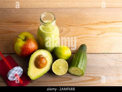 Homemade smoothie with the following detox ingredients avocado, cucumber, apple and lemon. Stock Photo