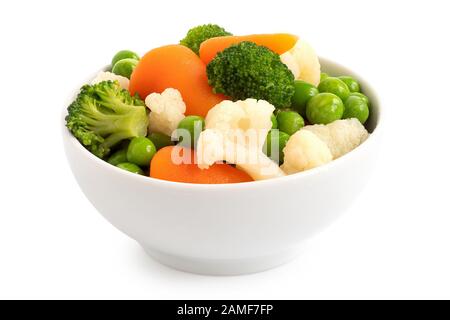 Mixed vegetables in white ceramic bowl isolated on white. Stock Photo